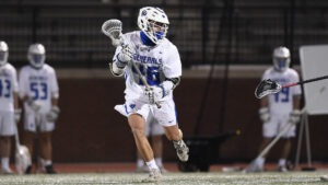 Danny Kung playing lacrosse at W&L